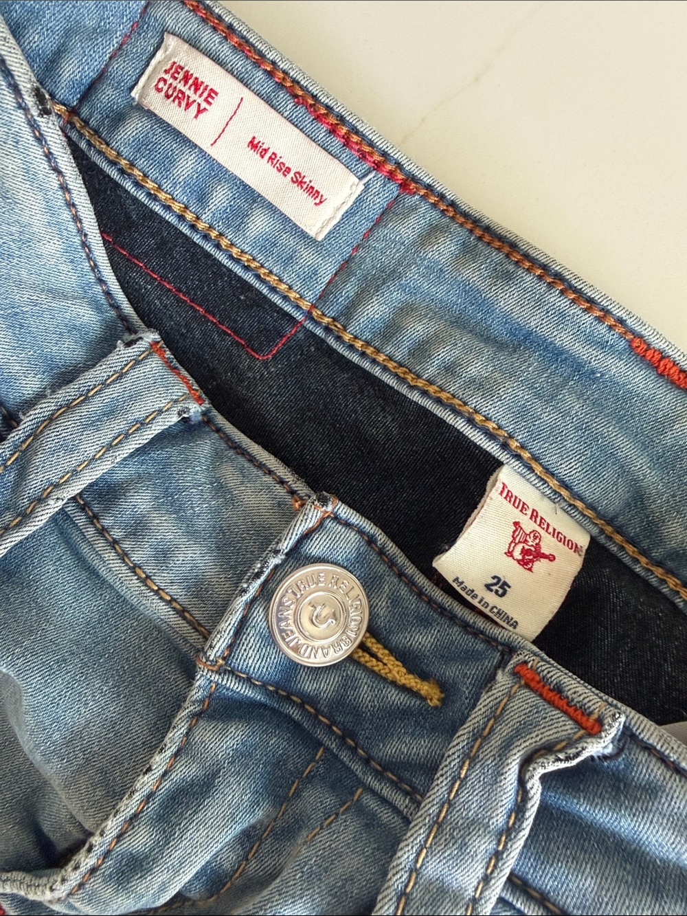 True Religion Light Blue Denim Mid-Rise Skinny Jeans with Orange Stitching
